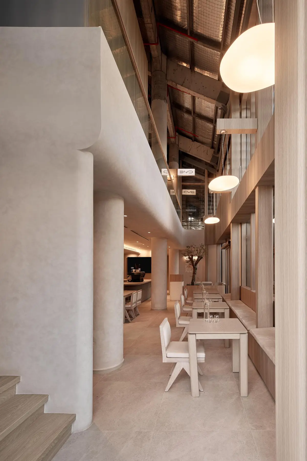 BYD café — portrait seating zone with warm light