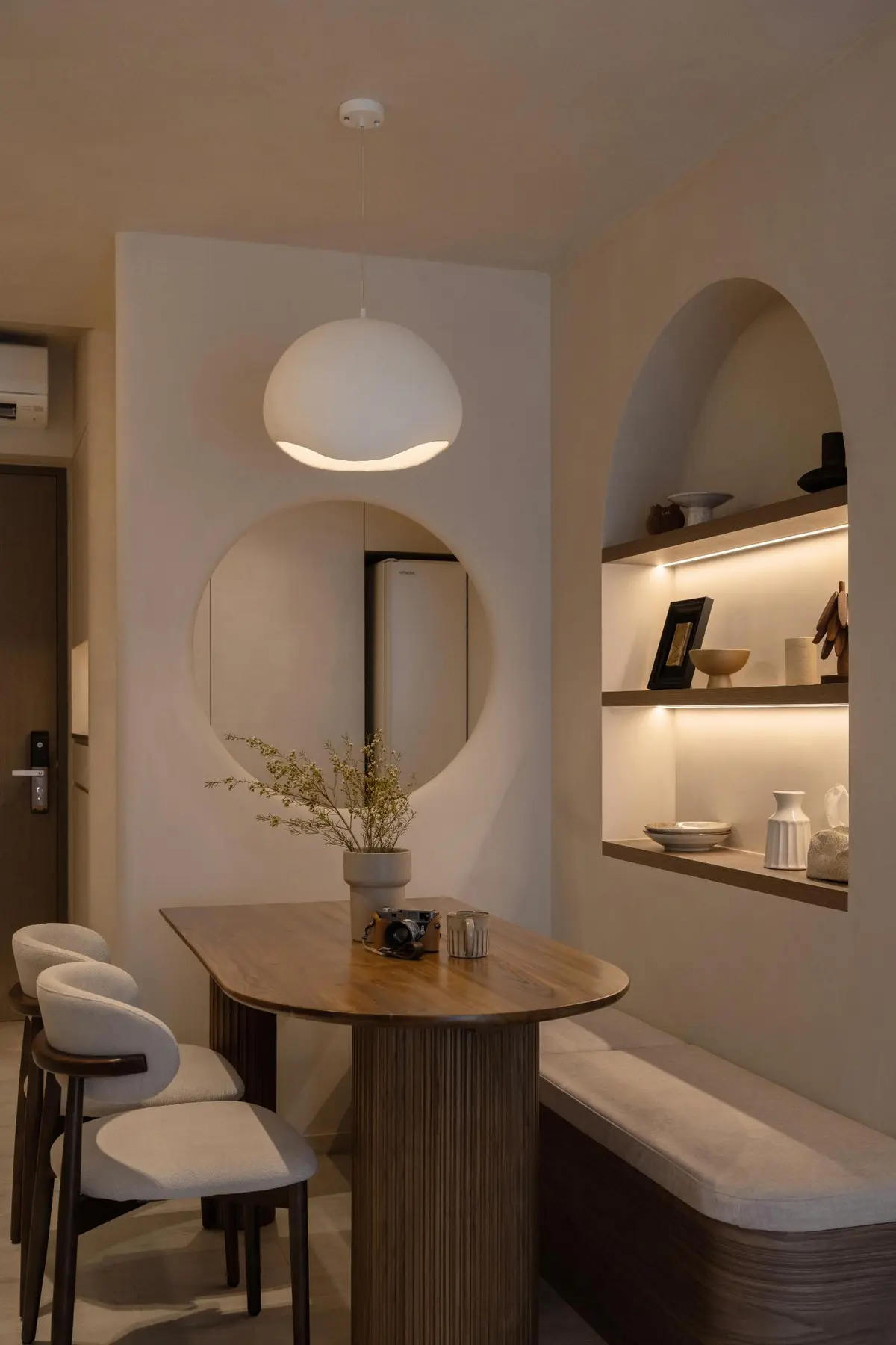 Portrait view — full height of globe pendant, circular mirror and arched niche