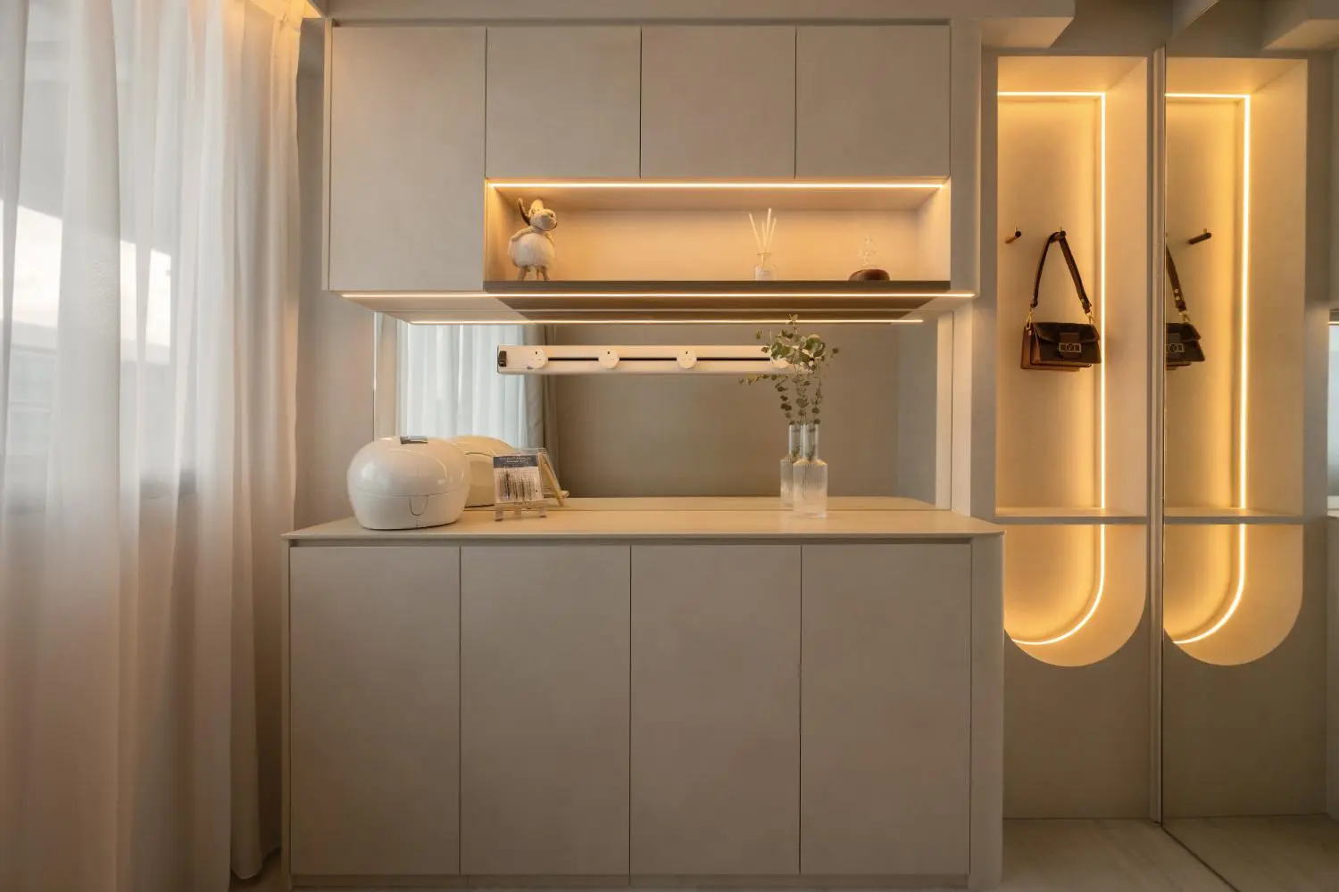 Dressing area — lit arch display cabinet, vanity and illuminated wardrobe