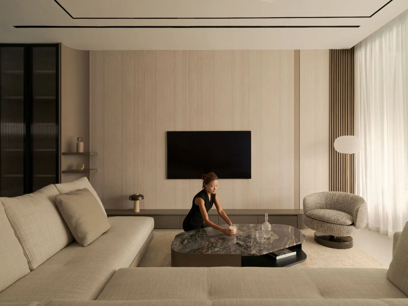 Telok Kurau living room with marble island and full-height feature wall