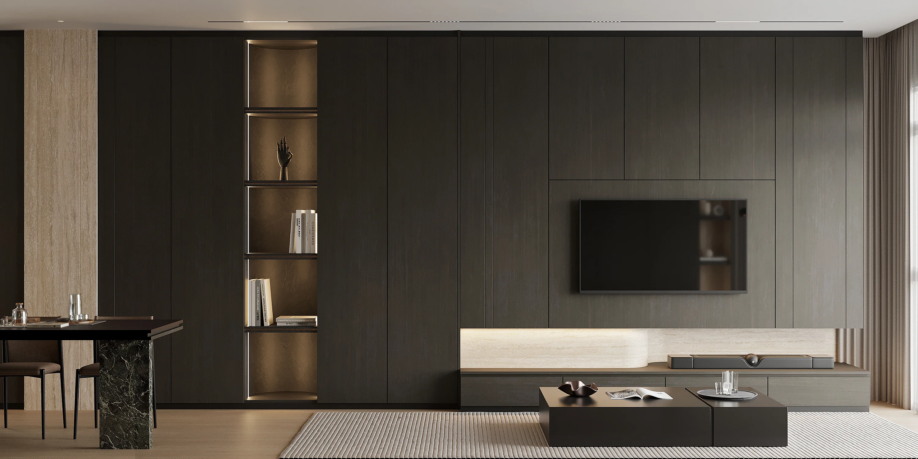 Living area looking toward pantry — warm lighting, dark cabinetry, curvaceous sofa