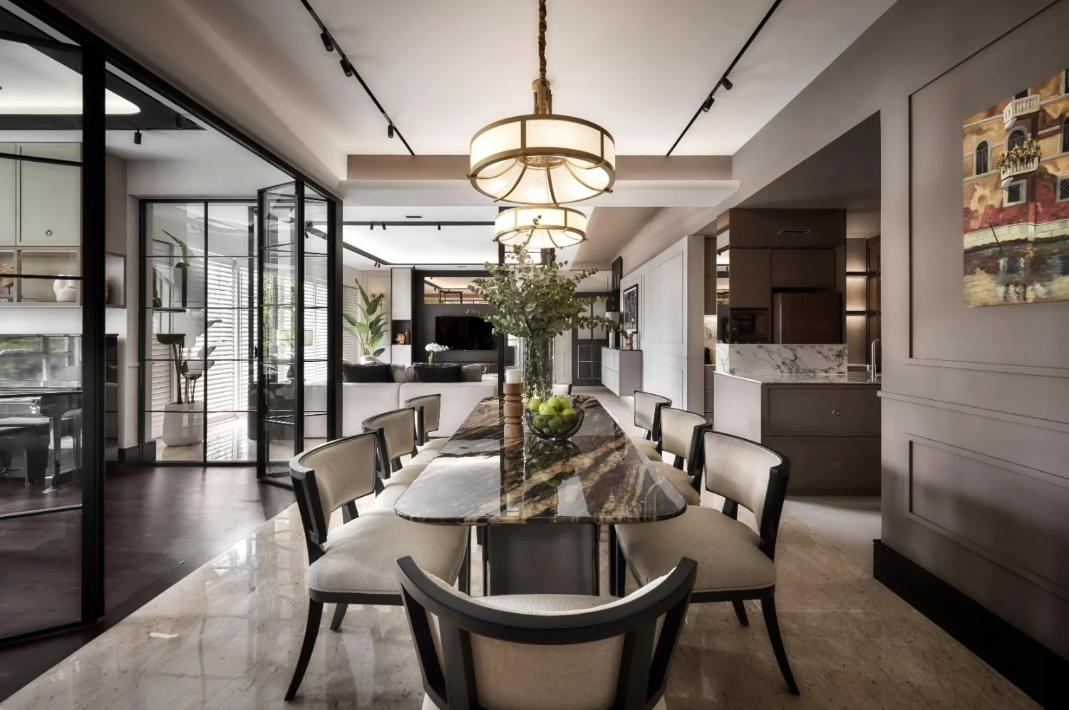 Dining area — round table, upholstered chairs, pendant lighting and art on wall