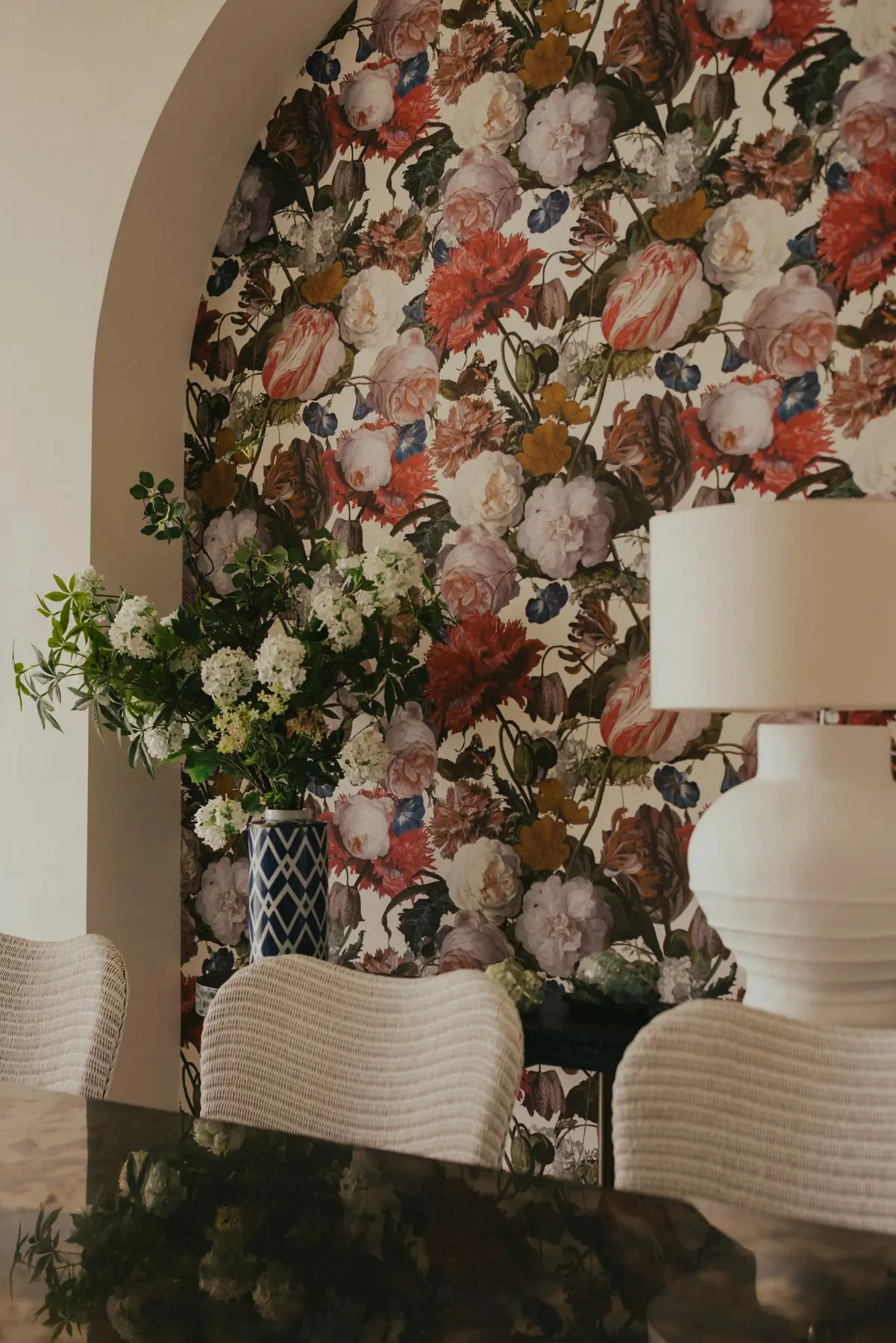 Aiden T — dining niche with floral wallpaper as a playful contrast