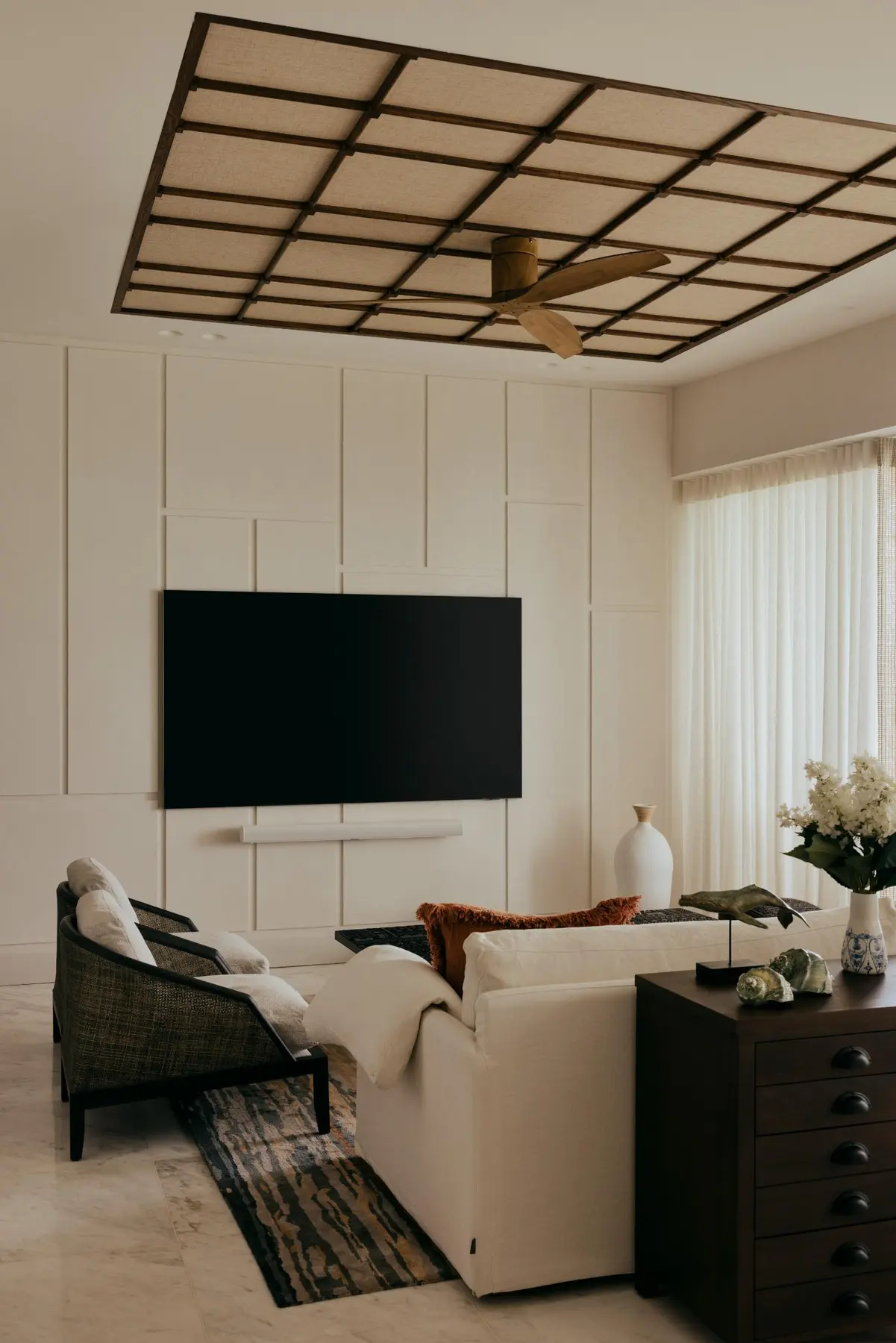 Aiden T — rattan and wood ceiling feature in living area